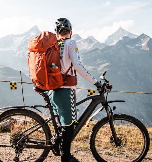 Outdoor Gear Stores - Man on Bike Trip in Mountains