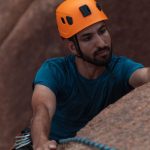 Climbing Equipment - Man in Helmet Rock Climbing