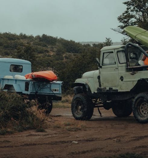 Kayaking Gear - A Man Doing a Thumbs Up while Riding a Truck