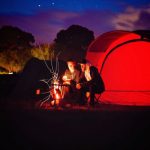 Camping - Man and Woman Sitting Beside Bonfire during Nigh Time