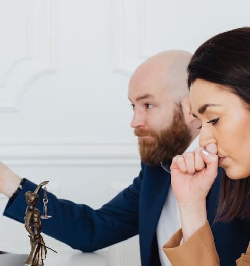 Expert Advice - Woman Sitting with Her Hand Touching Her Nose