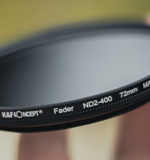 Outdoor Gear Brands - Close-up of a Person Holding a Camera Lens Filter