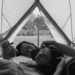 Sleeping Bags - Grayscale Photo of a Romantic Couple inside the Tent