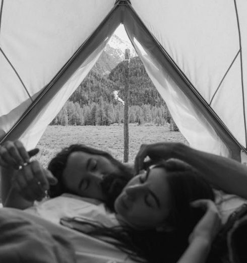 Sleeping Bags - Grayscale Photo of a Romantic Couple inside the Tent