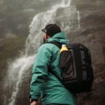 Outdoor Gear - Hiker by the Waterfall