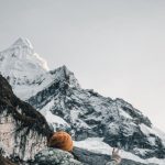 Hiking Gear - Hiker Posing on Trail with Snowcapped Mountain in Background