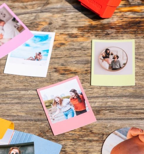 Personalized Gifts - Photographs Scattered on a Desk