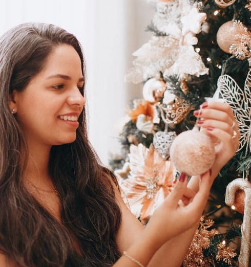 Last-Minute Gifts - Smiling Woman next to Christmas Tree