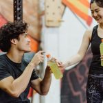 Fitness Gifts - A Woman Handing Out a Beverage Bottle