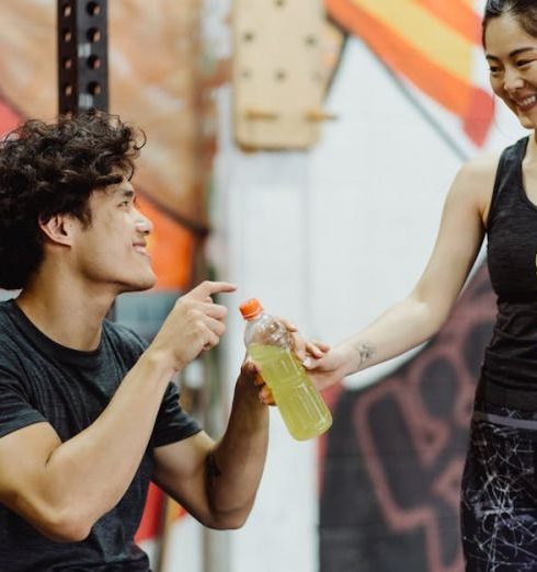 Fitness Gifts - A Woman Handing Out a Beverage Bottle