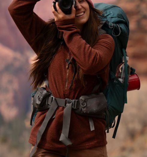 Outdoor Gear - Woman Hiking and Photographing in Zion National Park in the USA