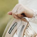 Luxury Shoes - A Bride Holding her Wedding Shoes