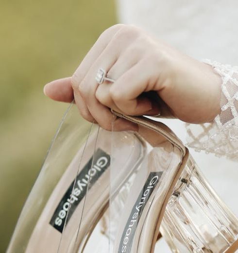 Luxury Shoes - A Bride Holding her Wedding Shoes