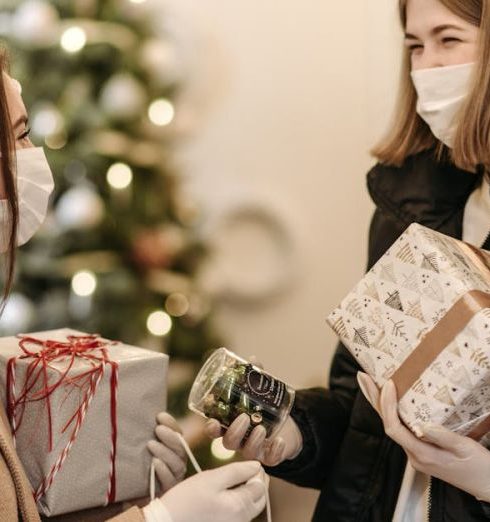 Shopping Events - Women Wearing Face Masks Holding Gifts