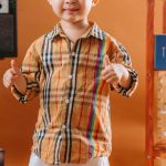 Art Pieces - Boy Posing in an Orange Room