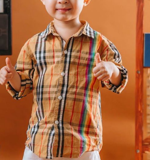 Art Pieces - Boy Posing in an Orange Room