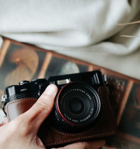 Bespoke Fashion - Man Holding Newspaper and Retro Camera