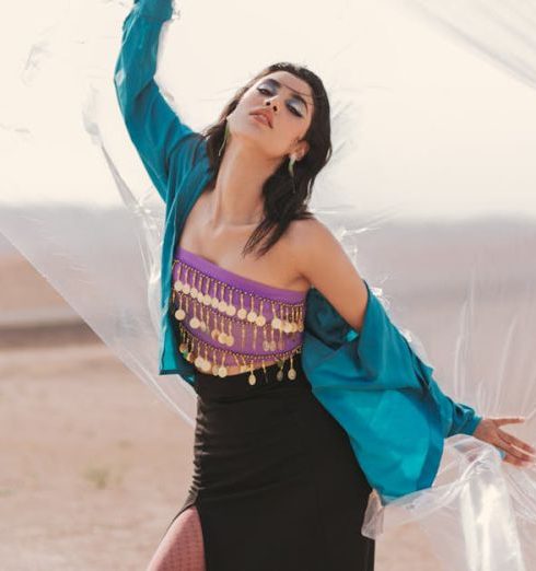 Sustainable Fashion - Woman Posing with Foil on Desert