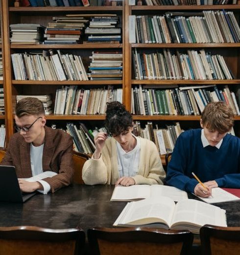 Reference Books - College Students Studying in a Library