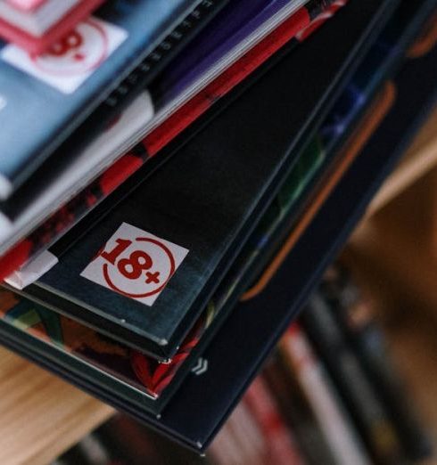 Graphic Novels - Close-Up Shot of a Stack of Books