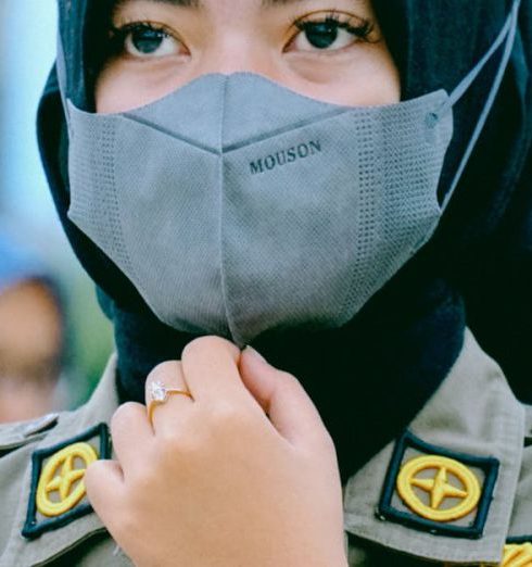 Local Authors - Young Woman Wearing Uniform and Face Mask