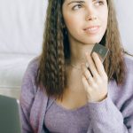 Affordable Gadgets - Woman Holding a Credit Card and a Laptop