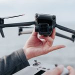 Drone Technology - Man Holding Drone and Its Controller