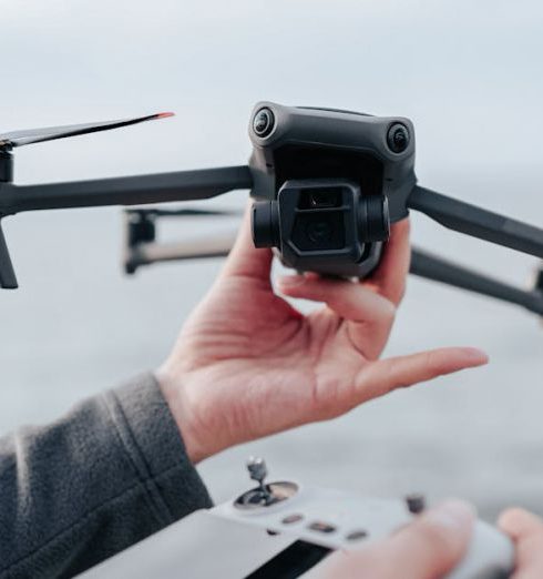 Drone Technology - Man Holding Drone and Its Controller