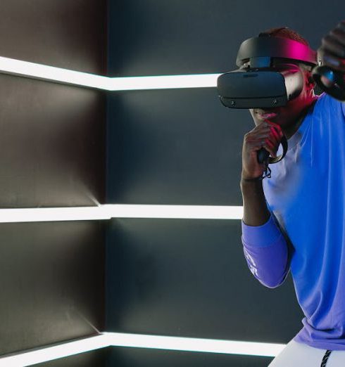 Tech Innovations - Man Playing on a Game with VR Headset