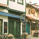 Antique Stores - Brown Wooden Chairs and Tables Outside Restaurants