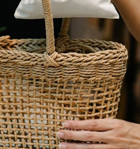 Home Goods - Person Putting Pouch on Woven Basket