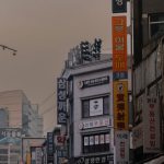 Pop-Up Shops - Street Among Buildings in Shadow