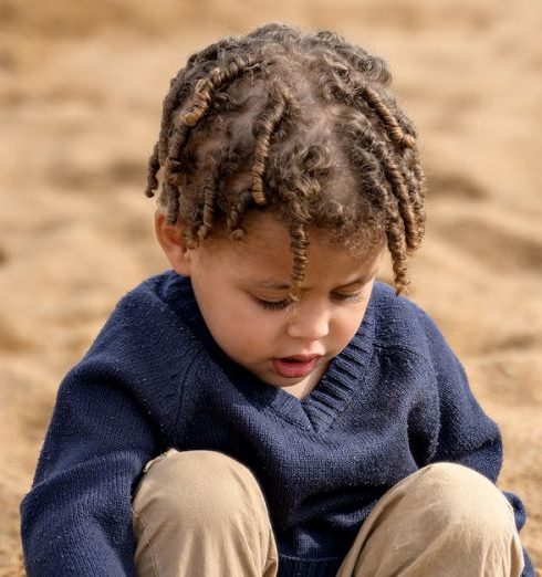 Children’s Toys - Boy Playing in the Sand With His Toys