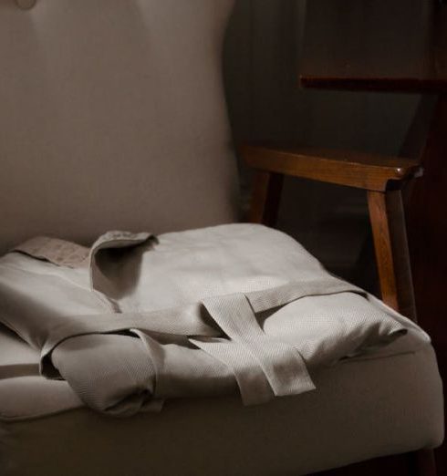 Quality Furniture - Folded Bathrobe on the Armchair