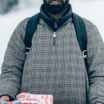 Seasonal Sales - A Bearded Man in Gray Jacket Holding a Tray with Biscuits