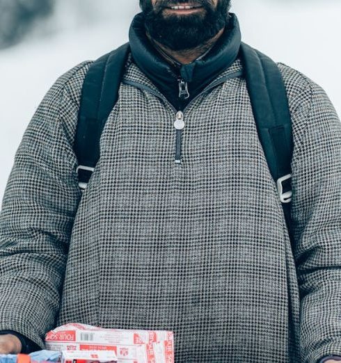 Seasonal Sales - A Bearded Man in Gray Jacket Holding a Tray with Biscuits