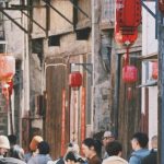 Family Outings - People Walking in Narrow Alley in Town