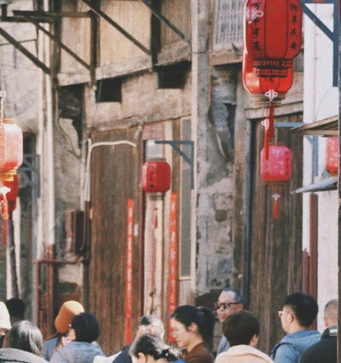 Family Outings - People Walking in Narrow Alley in Town