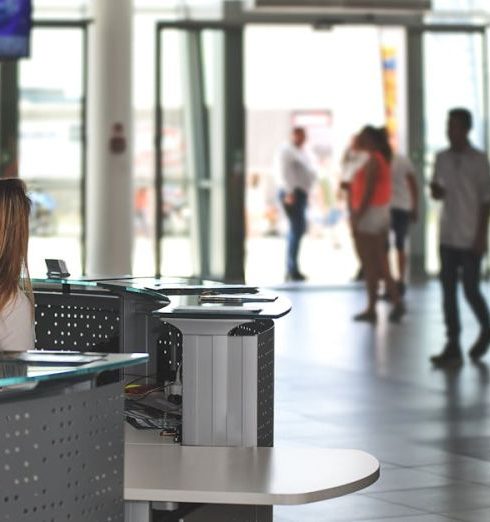 Customer Service - White Sitting Behind Counter Under Television