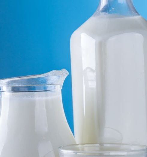 Dairy Products - Close-up of Milk Against Blue Background