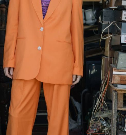 Sustainable Shopping - Photo of a Woman Wearing an Orange Suit