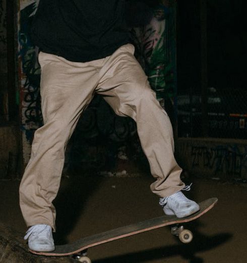 Outdoor Sports Equipment - Man doing trick on skateboard 