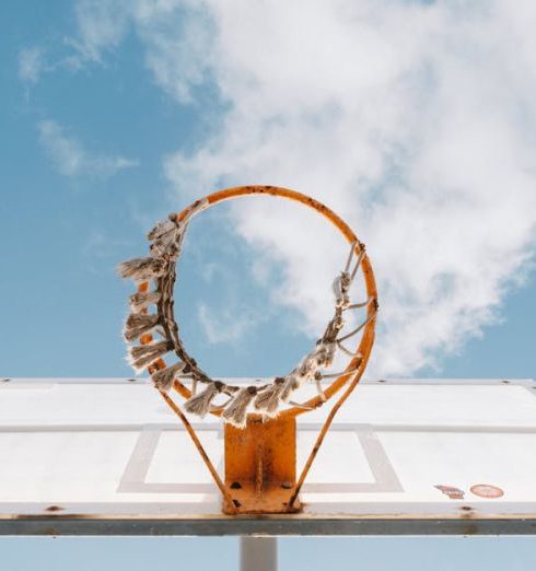 Sports Gear - Basketball hoop with blue sky background