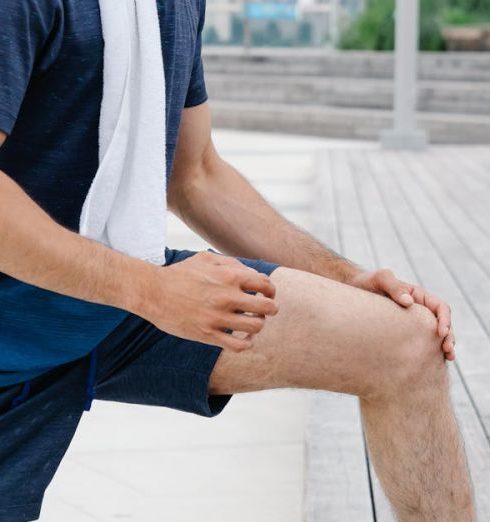 Fitness Accessories - Man stretching on a Wooden Platform