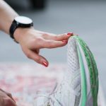 CrossFit Gear - Person Sitting on a Carpet Doing Foot Stretching