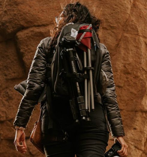 Hiking Gear - Woman in a Rocky Cave