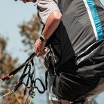 Affordable Equipment - A man with a backpack on a mountain