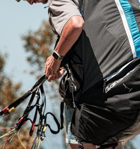 Affordable Equipment - A man with a backpack on a mountain