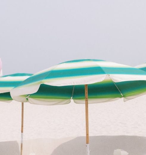 Family Activities - Striped Umbrellas on a Sandy Beach