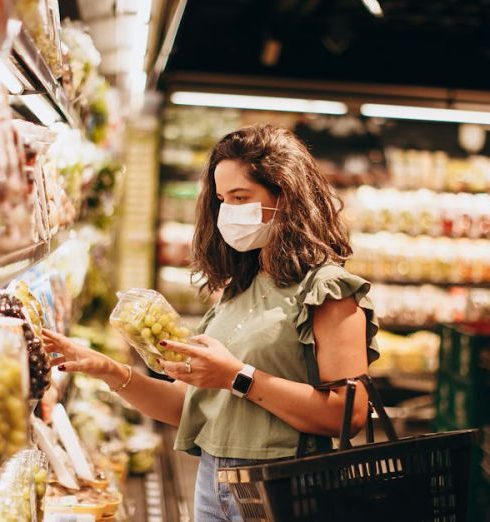 Health Food Stores - Woman Doing Grocery Shopping in a Supermarket